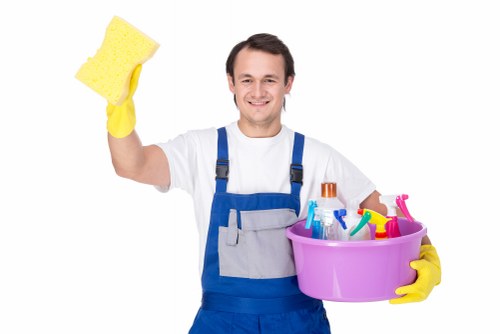 Local cleaner maintaining lift lobby and communal floor in Barnes