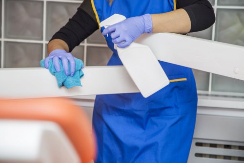 Worker inspecting a carpet cleaning area for slip hazards